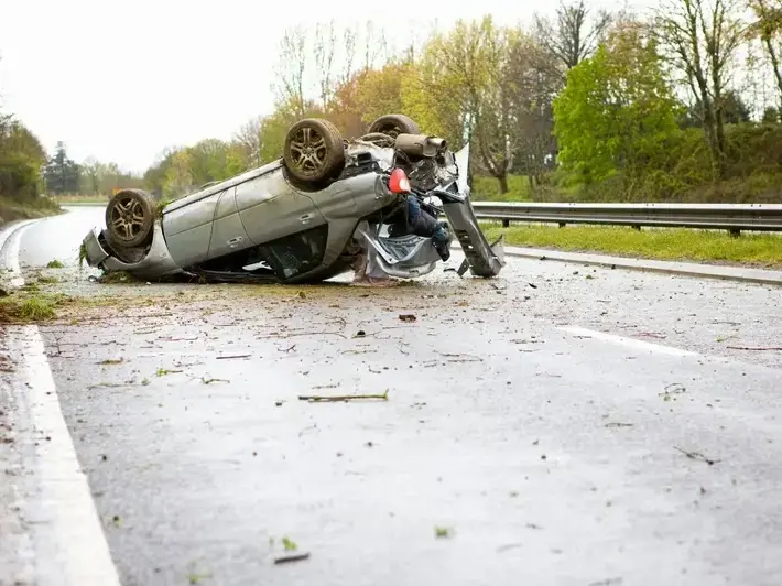 Illegal left turn accident attorney reviewing crash photos near Lakeview Recreation Center in Sun City AZ